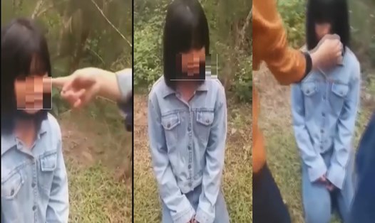 Cảnh một học sinh bị nhóm bạn bắt quỳ gối rồi tát vào mặt - Ảnh: cắt từ Clip