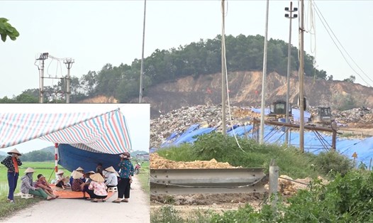 Người dân dựng lều bạt ngủ ngoài đường chặn xe vào bãi rác Nam Sơn. Ảnh: PV.