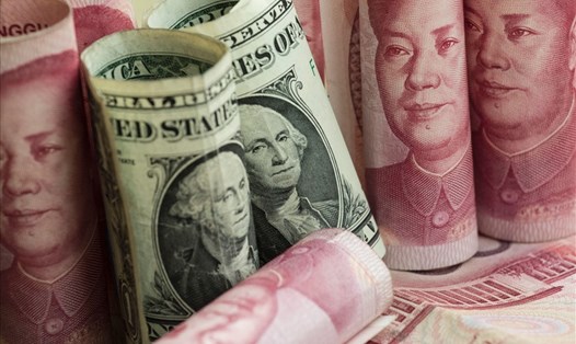 Trung Quốc liên tục giảm giá đồng nhân dân tệ so với đôla Mỹ. Ảnh: IBT