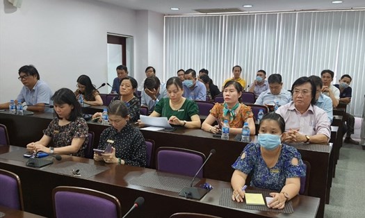 Các giáo viên Đại học Tôn Đức Thắng tham dự buổi công bố quyết định. Ảnh Nam Dương