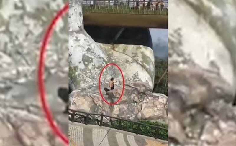 Người phụ nữ liều mình lẻo ra bàn tay khổng lồ để chụp ảnh tự sướng.