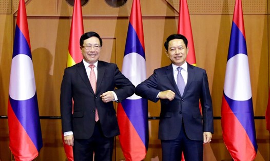 Phó Thủ tướng, Bộ trưởng Ngoại giao Phạm Bình Minh và Bộ trưởng Ngoại giao Lào Saleumxay Kommasith. Ảnh: Bộ Ngoại giao.