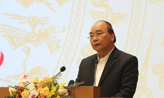 Thủ tướng Chính phủ Nguyễn Xuân Phúc phát biểu tại Hội nghị trực tuyến toàn quốc về công tác giảm nghèo. Ảnh T.Vương