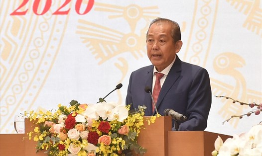Phó Thủ tướng Thường trực Chính phủ Trương Hòa Bình báo cáo về tình hình thực hiện kế hoạch phát triển KTXH năm 2020 và 5 năm 2016-2020; dự kiến phương hướng, nhiệm vụ thời gian tới - Ảnh: Quang Hiếu