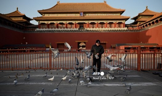 Thủ đô Bắc Kinh, Trung Quốc hôm 29.12 đã tiến hành tái phong tỏa một quận để ngăn chặn đại dịch COVID-19 bùng phát. Ảnh: AFP