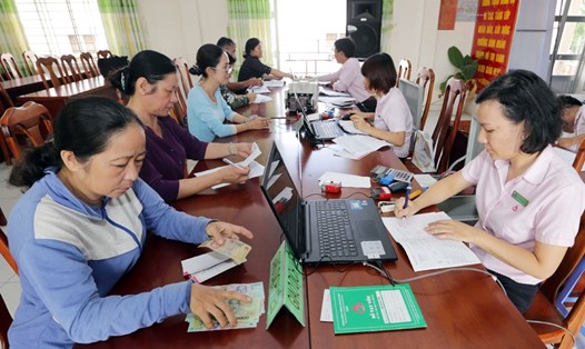 Hoạt động của NHCSXH tại các điểm giao dịch xã trong cả nước (Hình ảnh thực hiện trước ngày 01/4/2020) - Ảnh: Trần Việt