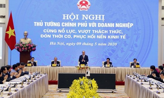 Thủ tướng Nguyễn Xuân Phúc và các Phó Thủ tướng chủ trì hội nghị tại điểm cầu Hà Nội. Ảnh: Thống Nhất/TTXVN