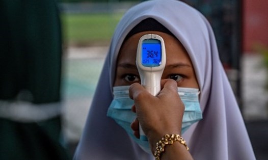 Malaysia thông báo vừa phát hiện đột biến của SARS-CoV-2 khiến đại dịch COVID-19 dễ lây hơn gấp 10 lần. Ảnh: AFP
