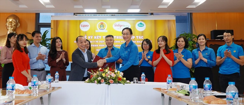 Toàn cảnh lễ ký kết thỏa thuận phúc lợi cho đoàn viên. Ảnh: Tiến Hưng