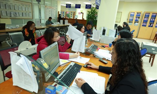 Giải quyết thủ tục hành chính trong lĩnh vực thuế ở Cục Thuế Hà Nội. Ảnh: Hải Nguyễn