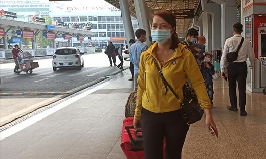 Hành khách đeo khẩu trang tại sân bay Tân Sơn Nhất ngày 28.1, đảm bảo phòng dịch COVID-19. Ảnh: Chân Phúc
