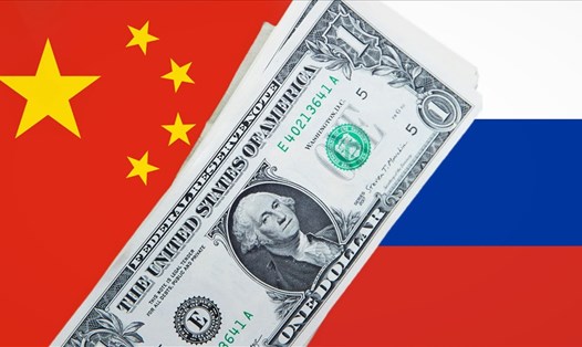 Nga và Trung Quốc đẩy nhanh việc thoát phụ thuộc vào đống USD. Ảnh: AFP