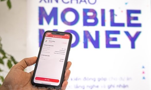 Dự kiến trong tháng 10 này sẽ cấp phép thí điểm Mobile-Money. Ảnh: Minh Sơn/Vietnam+