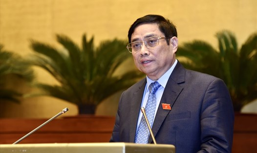 Thủ tướng Chính phủ Phạm Minh Chính trình bày Báo cáo kết quả thực hiện kế hoạch phát triển kinh tế-xã hội năm 2021; dự kiến kế hoạch phát triển kinh tế-xã hội năm 2022. Ảnh: VGP