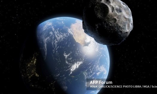 Mô phỏng tiểu hành tinh bay gần Trái đất. Ảnh: AFP