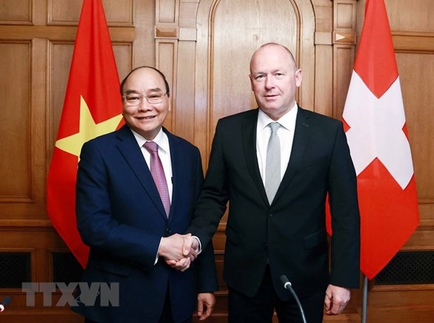 Chủ tịch nước Nguyễn Xuân Phúc hội kiến với Chủ tịch Hội đồng Quốc gia Liên bang Thụy Sĩ Andreas Aebi. Ảnh: TTXVN