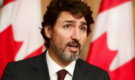 Thủ tướng Canada Justin Trudeau cho biết nước này sẽ áp dụng biện pháp hạn chế COVID-19 mới từ 15.2. Ảnh: AFP