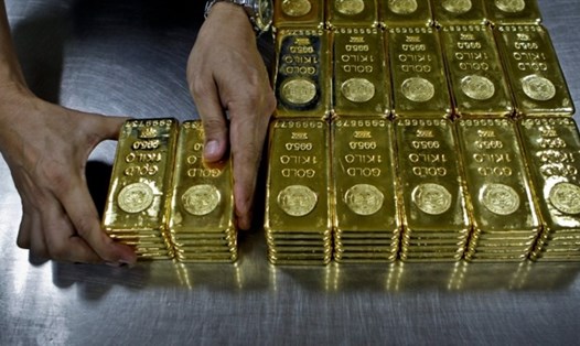 Giá vàng biến động mạnh nếu Mỹ tăng thuế. Ảnh: AFP
