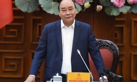 Thủ tướng Nguyễn Xuân Phúc yêu cầu xem xét biện pháp phòng dịch phù hợp khi triển khai “hộ chiếu vaccine". Ảnh: Quang Hiếu