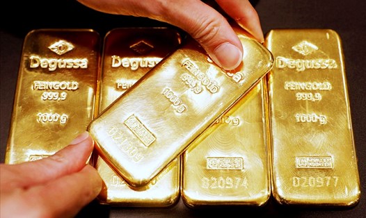 Giá vàng thế giới đã phục hồi tốt thời gian gần đây. Tuy nhiên triển vọng tăng của giá vàng có thể bị tác động trong ngắn hạn do lo ngại lạm phát. Ảnh AFP