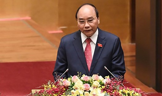 Thủ tướng Nguyễn Xuân Phúc trình bày báo cáo công tác nhiệm kỳ 2016-2021 của Chính phủ tại kỳ họp. Ảnh: Nhật Bắc
