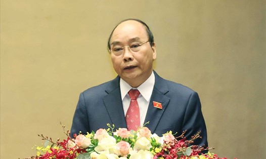 Thủ tướng Nguyễn Xuân Phúc trình bày báo cáo công tác nhiệm kỳ 2016-2021 của Chính phủ tại kỳ họp thứ 11, Quốc hội khoá XIV ngày 24.3. Ảnh: TTXVN