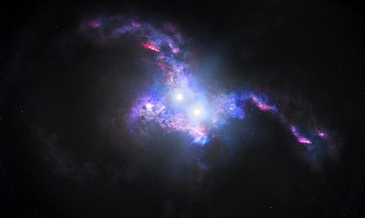 Ánh sáng rực rỡ của hai chuẩn tinh nằm trong lõi của hai thiên hà đang trong quá trình hợp nhất. Ảnh: NASA