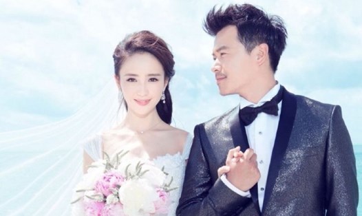 Đồng Lệ Á, Trần Tư Thành trong ngày cưới năm 2014. Ảnh: Xinhua