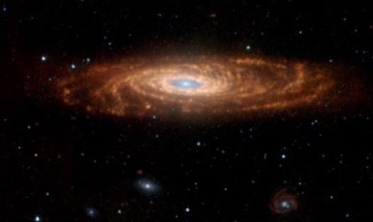 Một thiên hà xoắn ốc tương tự dải Ngân hà quan sát được từ kính thiên văn. Ảnh: AFP