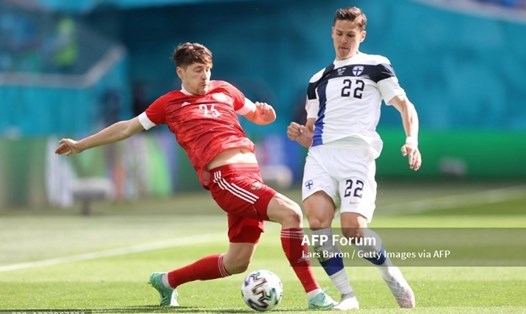 Đội tuyển Nga (áo đỏ) gặp nhiều khó khăn trước Phần Lan. Ảnh: AFP