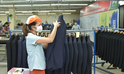 Sản xuất, xuất khẩu dệt may có nhiều tín hiệu lạc quan trong năm 2021. Ảnh: Ngọc Hân