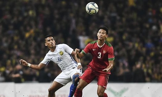 Andy Setyo Nugroho (phải) là trung vệ trụ cột của tuyển Indonesia vài năm qua. Ảnh: AFP.