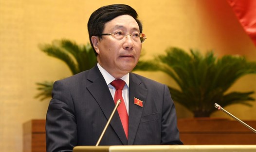 Ủy viên Bộ Chính trị, Phó Thủ tướng Chính phủ Phạm Bình Minh báo cáo tại kỳ họp thứ nhất, Quốc hội khóa XV sáng 22.7. Ảnh: Nhật Bắc