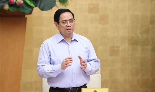 Thủ tướng Phạm Minh Chính yêu cầu rà soát pháp luật, tháo gỡ khó khăn cho đầu tư, kinh doanh trong điều kiện dịch COVID-19. Ảnh: TTXVN