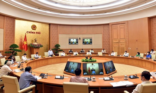 Thủ tướng Phạm Minh Chính chủ trì cuộc họp về nghiên cứu, sản xuất vaccine, thuốc phòng, chống COVID-19 trong nước. Ảnh Nhật Bắc