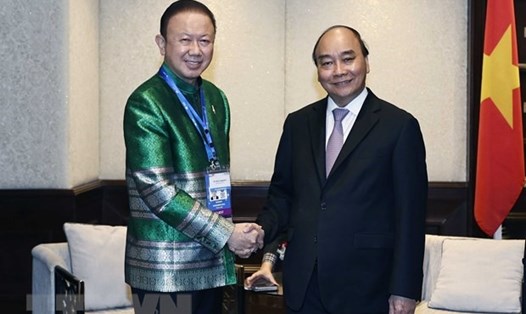 Chủ tịch nước Nguyễn Xuân Phúc và Chủ tịch Hội Hữu nghị Thái Lan-Việt Nam Sanan Angubolkul. Ảnh: TTXVN