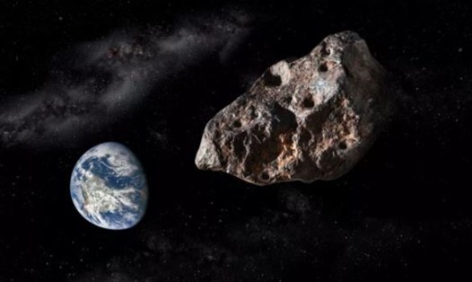 Minh họa tiểu hành tinh nguy hiểm tiềm tàng lao ngang qua Trái đất. Ảnh: NASA