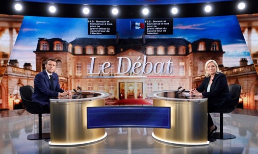 Ông Emmanuel Macron và bà Marine Le Pen tranh luận trên truyền hình hôm 20.4. Ảnh: AFP