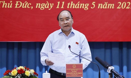 Chủ tịch nước Nguyễn Xuân Phúc phát biểu tại buổi xúc cử tri Thành phố Thủ Đức. 
 Ảnh: Vũ Dũng