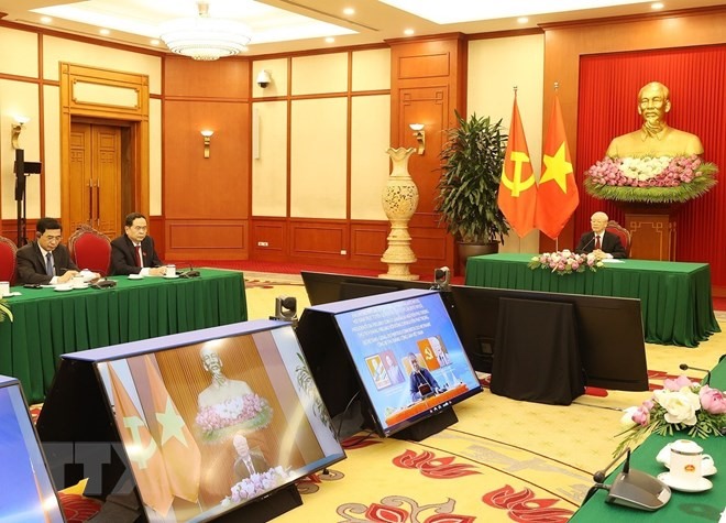 Tổng Bí thư Nguyễn Phú Trọng hội đàm trực tuyến với Chủ tịch Đảng Mặt trận Giải phóng Mozambique, Tổng thống Mozambique Filipe Jacinto Nyusi. Ảnh: TTXVN