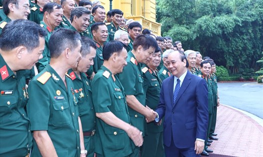 Chủ tịch nước Nguyễn Xuân Phúc cùng các đại biểu. Ảnh: VPCTN