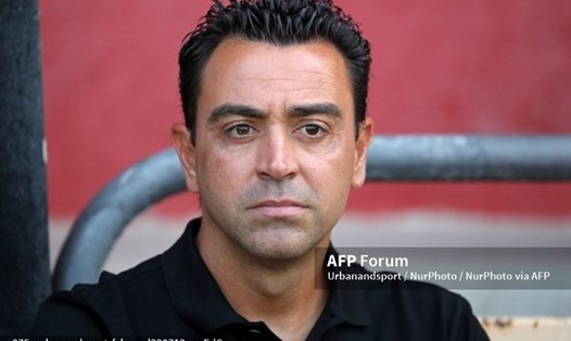 Xavi chưa thể sang Mỹ cùng với Barcelona.  Ảnh: AFP
