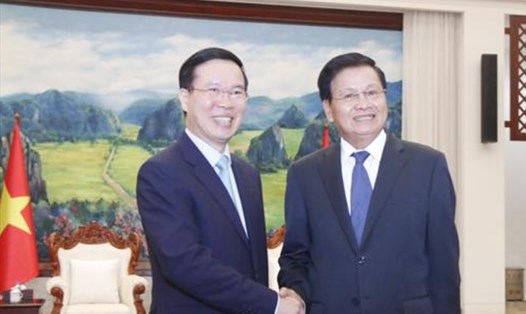 Tổng Bí thư, Chủ tịch nước Lào Thongloun Sisoulith tiếp Ủy viên Bộ Chính trị, Thường trực Ban Bí thư Võ Văn Thưởng, chiều 17.7.2022. Ảnh: TTXVN