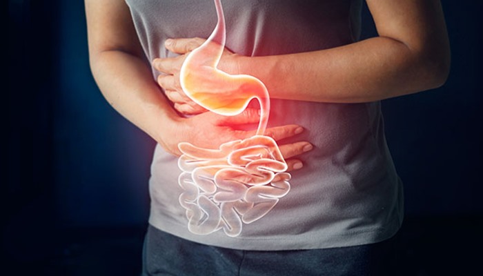 Đau dạ dày là bệnh thường gặp dịp Tết. Ảnh: Upper Cervical Care.