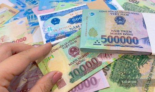 Dự báo Ngân hàng Nhà nước Việt Nam sẽ tăng lãi suất thêm 100 điểm cơ bản trong quý I/2023. Ảnh: Trà My