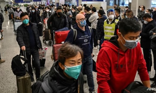 Hành khách tại sân bay quốc tế Phố Đông Thượng Hải, Trung Quốc. Ảnh: AFP