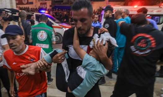 Hàng trăm người bị thương và thiệt mạng trong vụ tấn công bệnh viện ở Gaza ngày 17.10. Ảnh: AFP