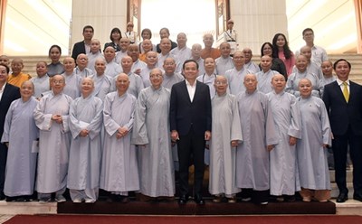 Phó Thủ tướng Chính phủ Trần Lưu Quang cùng các đại biểu dự buổi gặp mặt. Ảnh: Thanh Hà