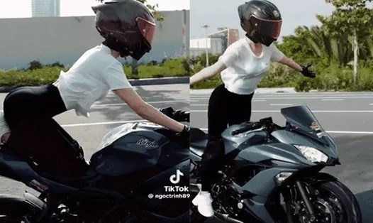 Clip người phụ nữ (được cho là Ngọc Trinh) lái xe môtô thả hai tay trên đường gây xôn xao. Ảnh: Cắt từ clip.