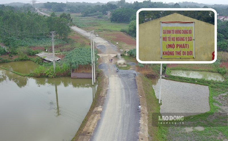 Ngôi mộ nằm giữa tuyến đường liên vùng 1.900 tỉ đồng. Ảnh: Tô Công.